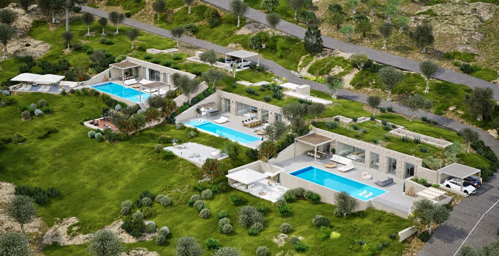 Aerial view of the three villas, each on its own terrace above the bay.